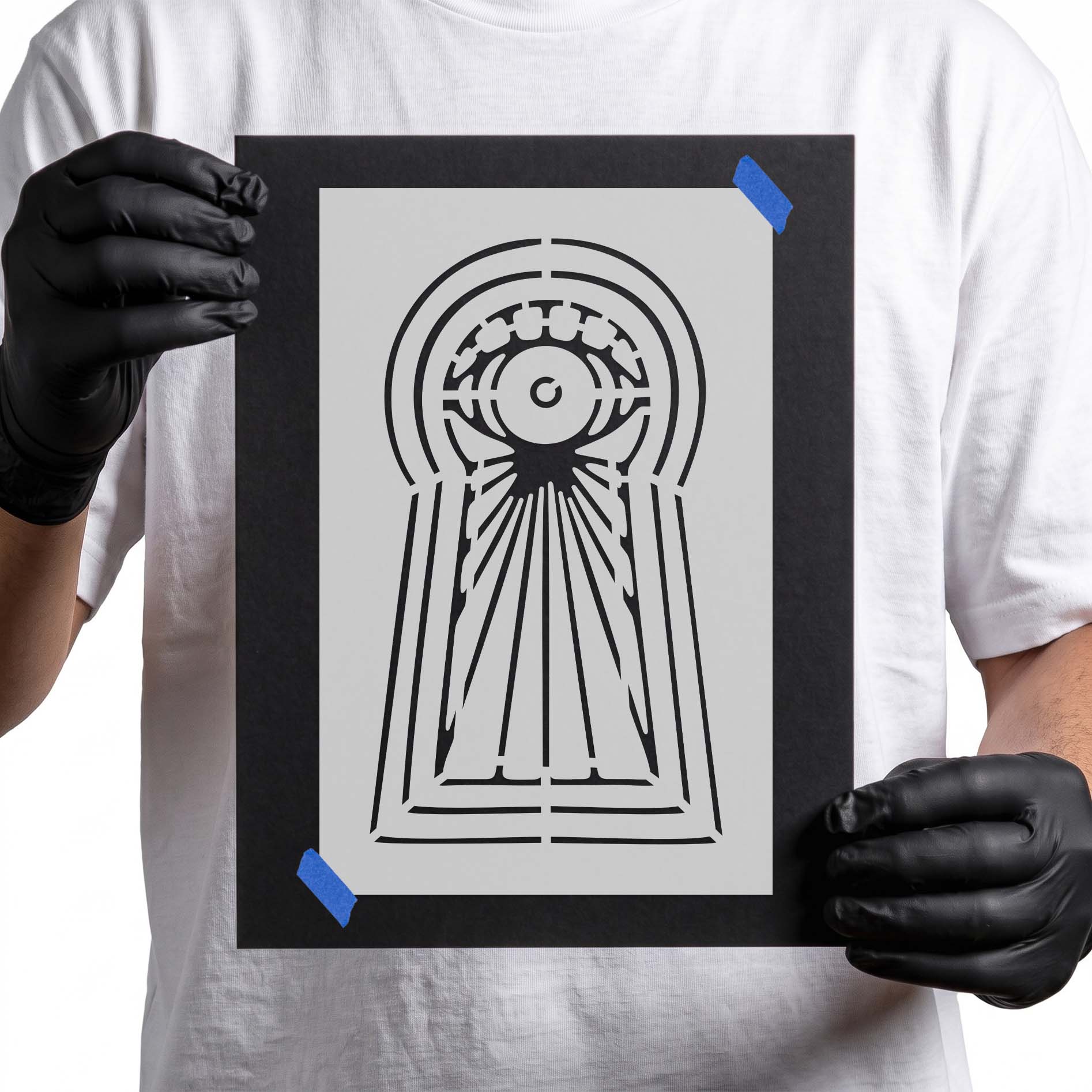 Mystical eye stencil centered inside an ornate elongated keyhole