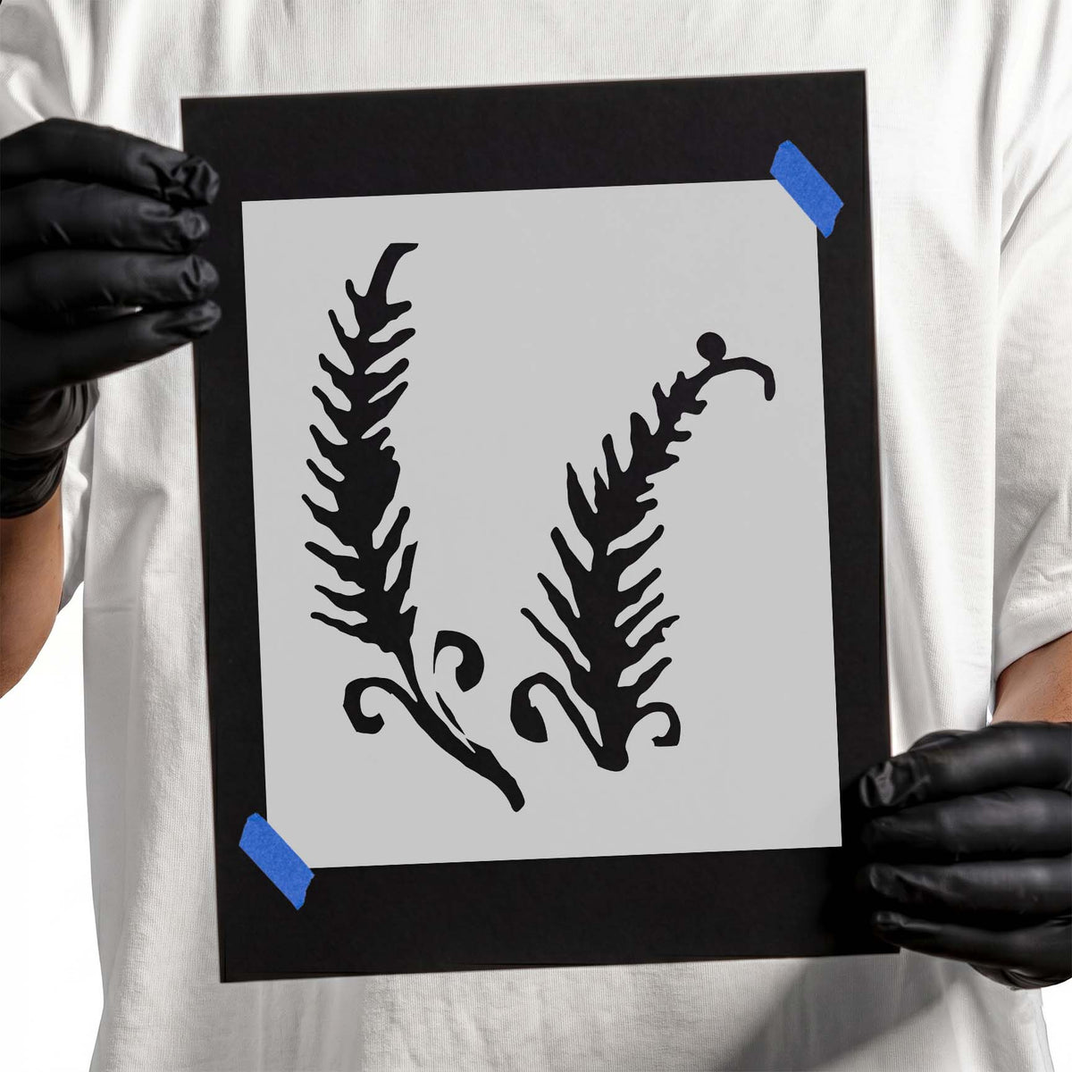 Fiddlehead fern stencil with two curled botanical fronds