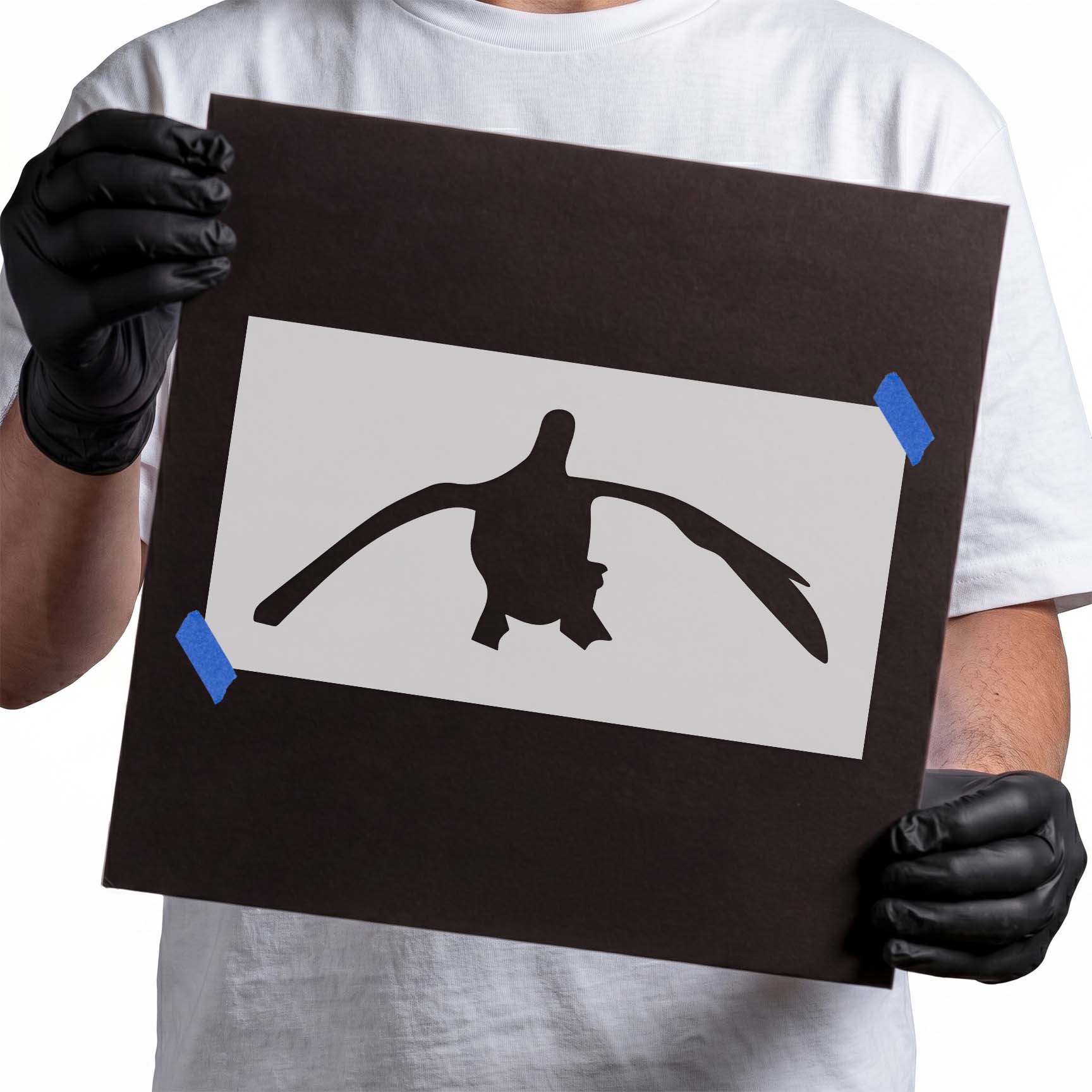 Flying duck stencil with wide outstretched wings and visible feet