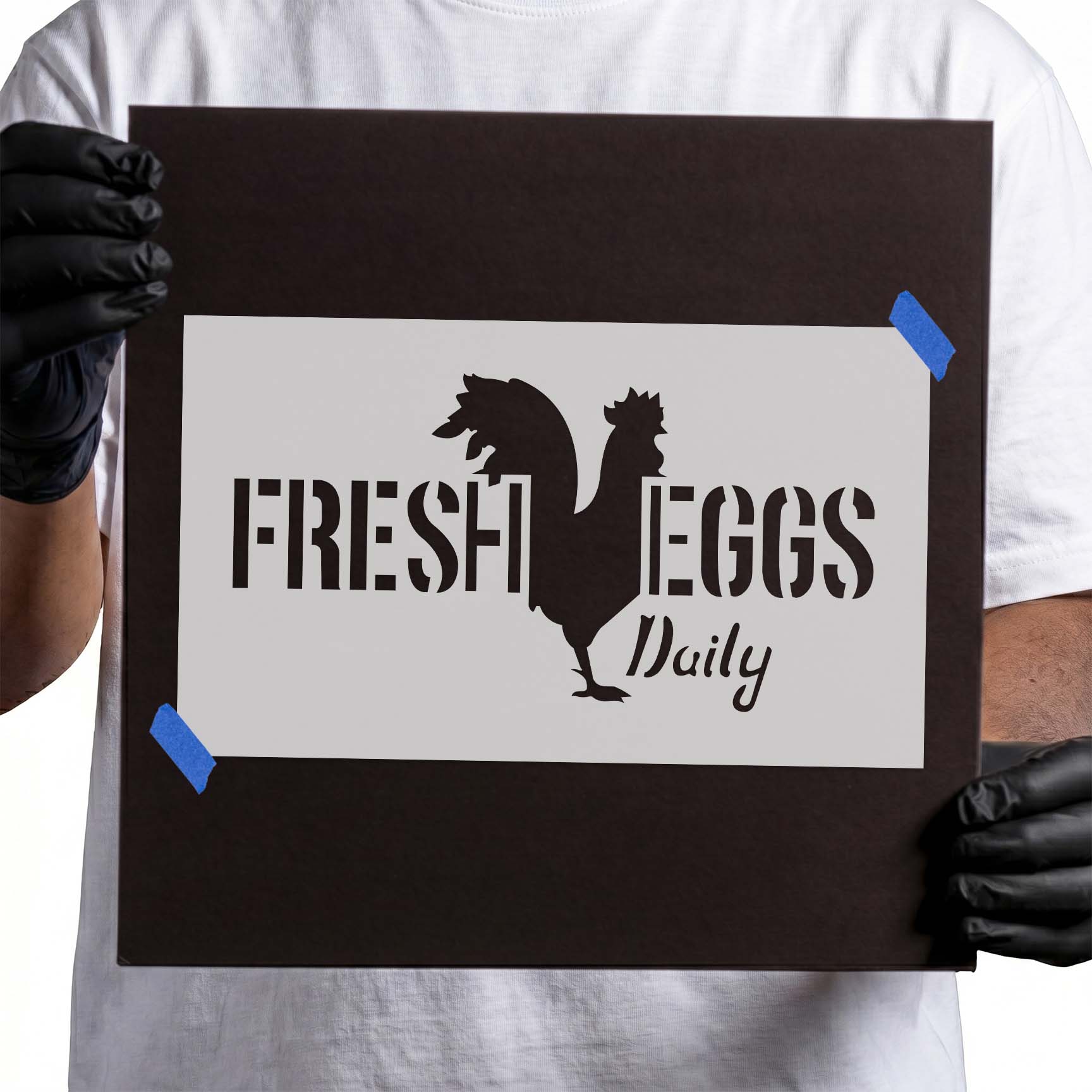 Fresh eggs daily stencil lettering with large rooster silhouette