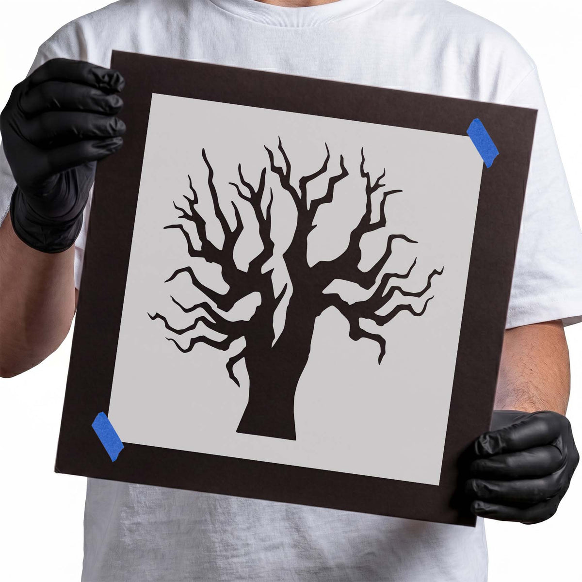 Bare tree stencil with thick trunk and twisting leafless branches