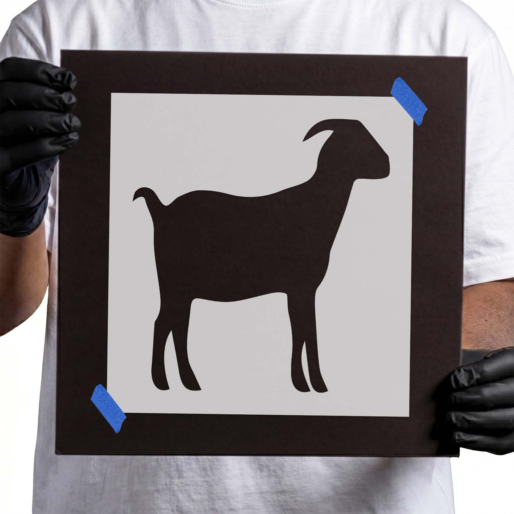 Person holding a reusable Goat Stencil