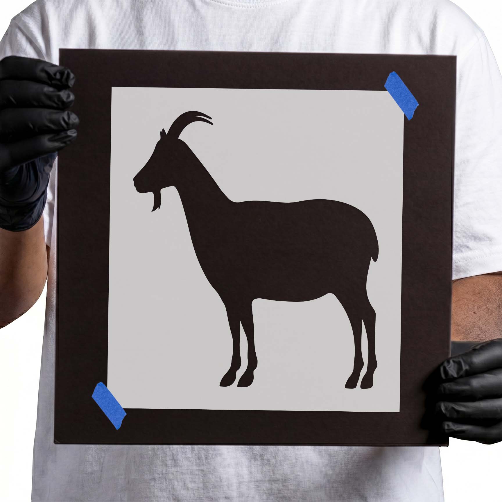 Gloved hands holding a Mylar Goat Stencil
