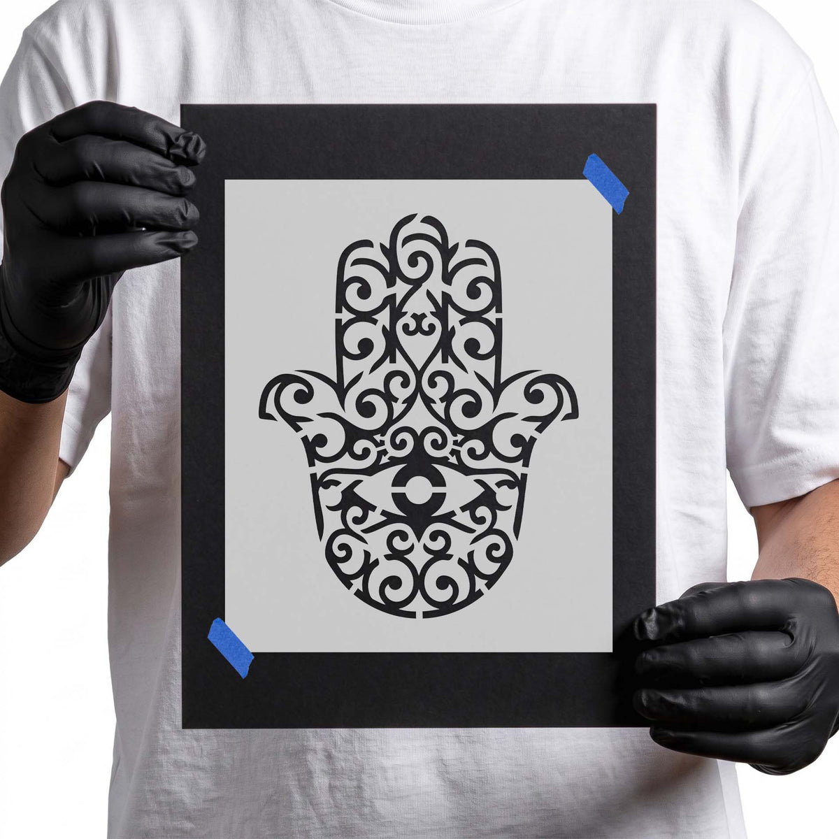 Ornate Hamsa stencil with central eye and symmetrical swirling details