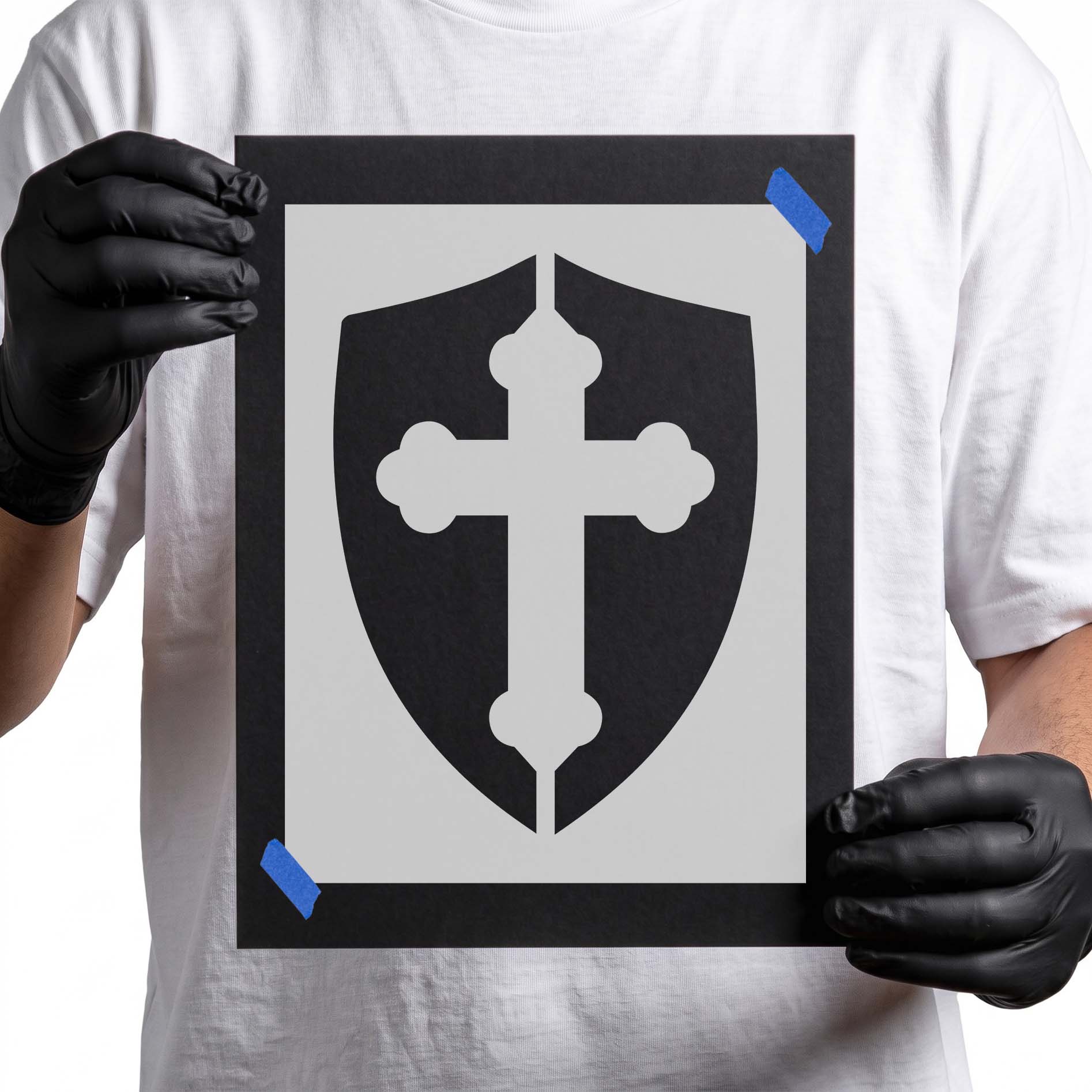 Christian cross stencil centered inside a bold shield silhouette