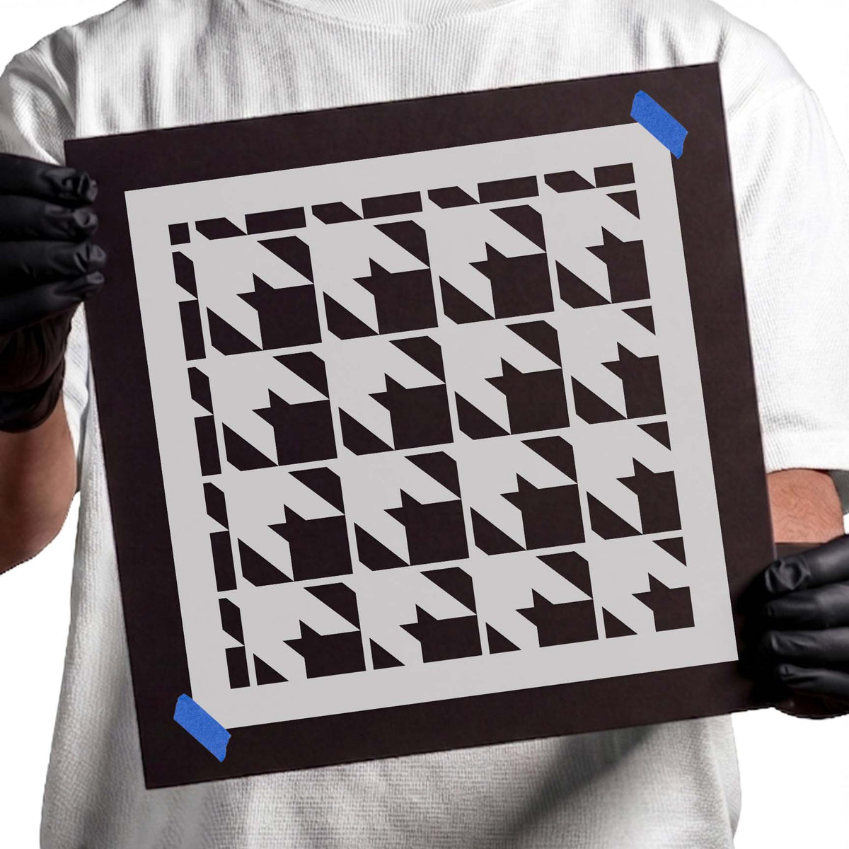 Stencil featuring repeating interlocking shapes in a classic houndstooth pattern