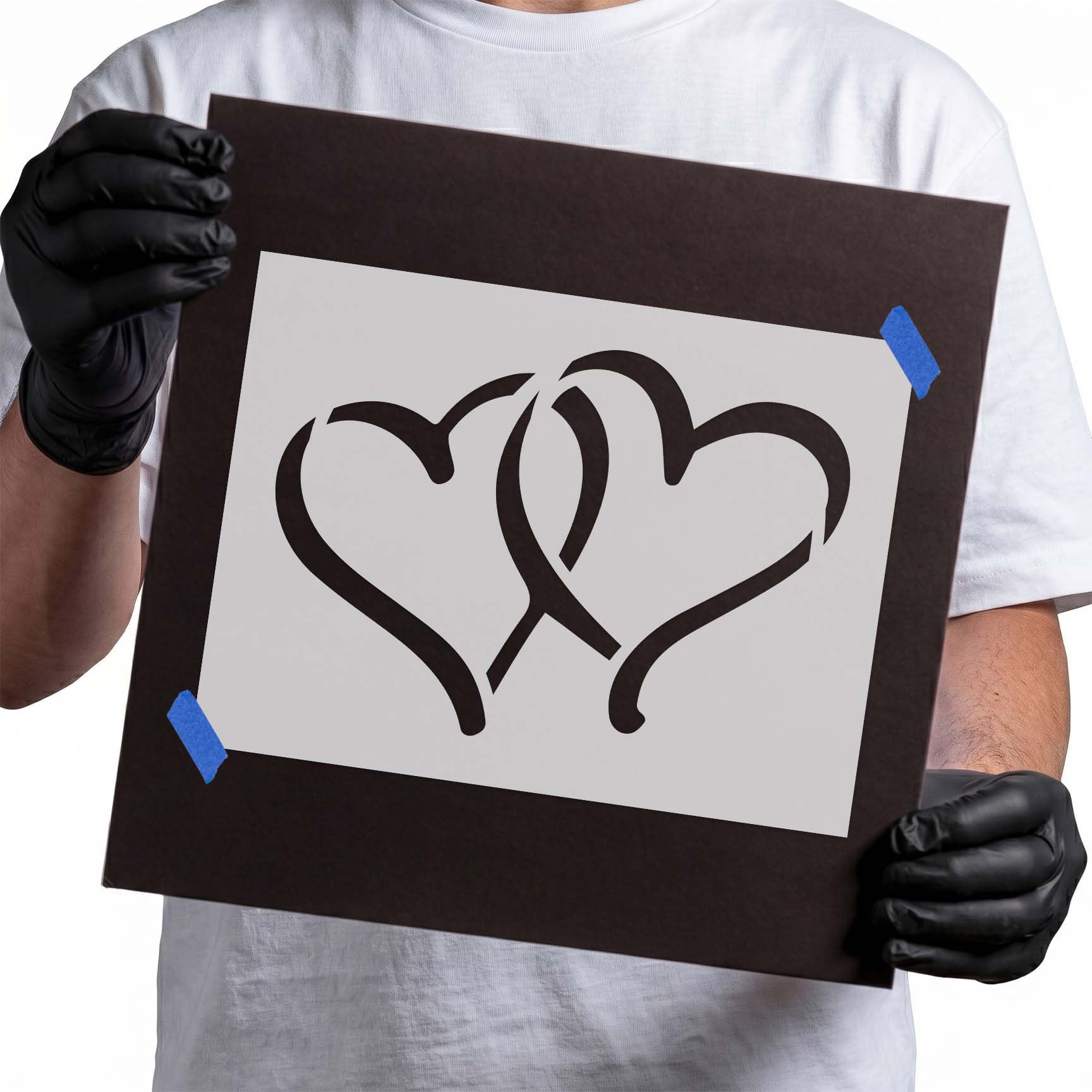 Stencil featuring two interlocking heart outlines with sweeping curved lines