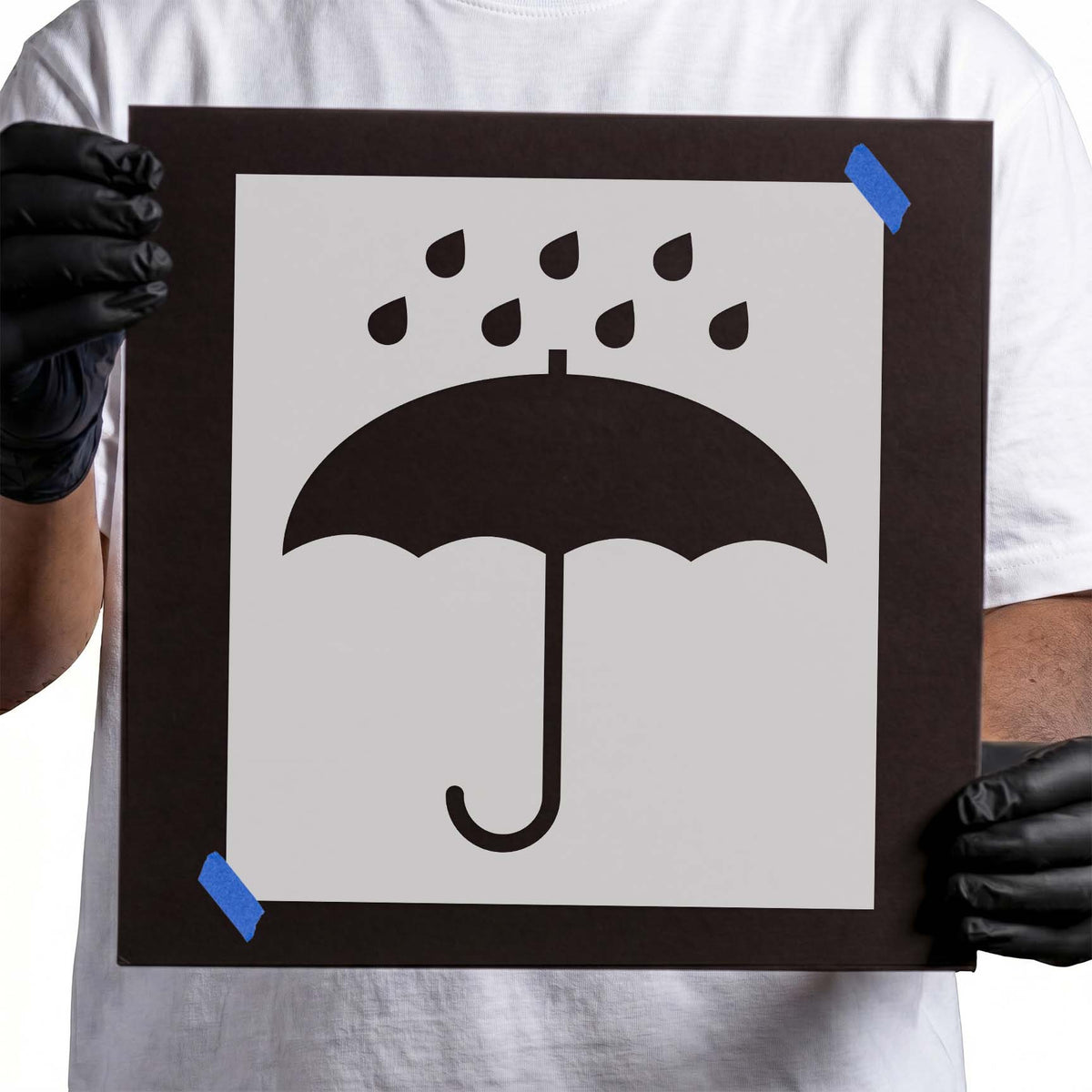 Keep dry stencil with umbrella silhouette and falling raindrops