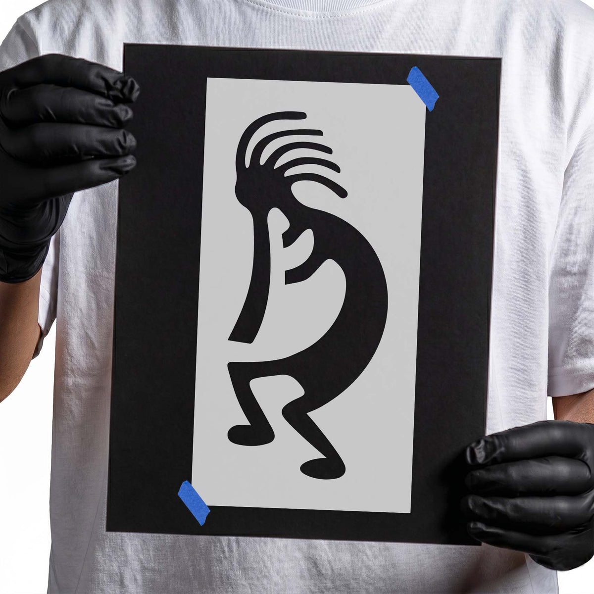 Kokopelli stencil with curved figure, flute and distinctive crest