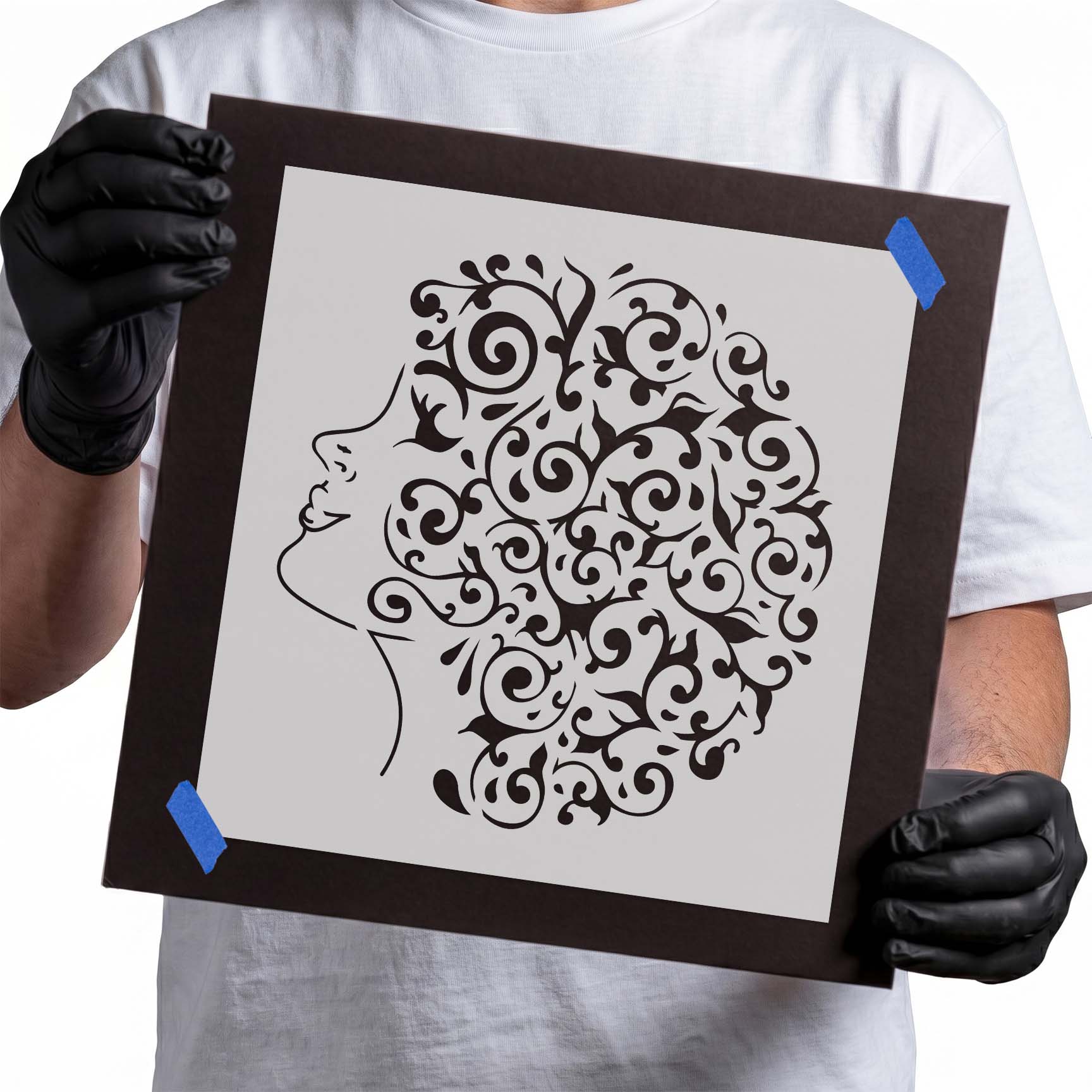 Woman profile stencil with ornate floral curls and leafy hair