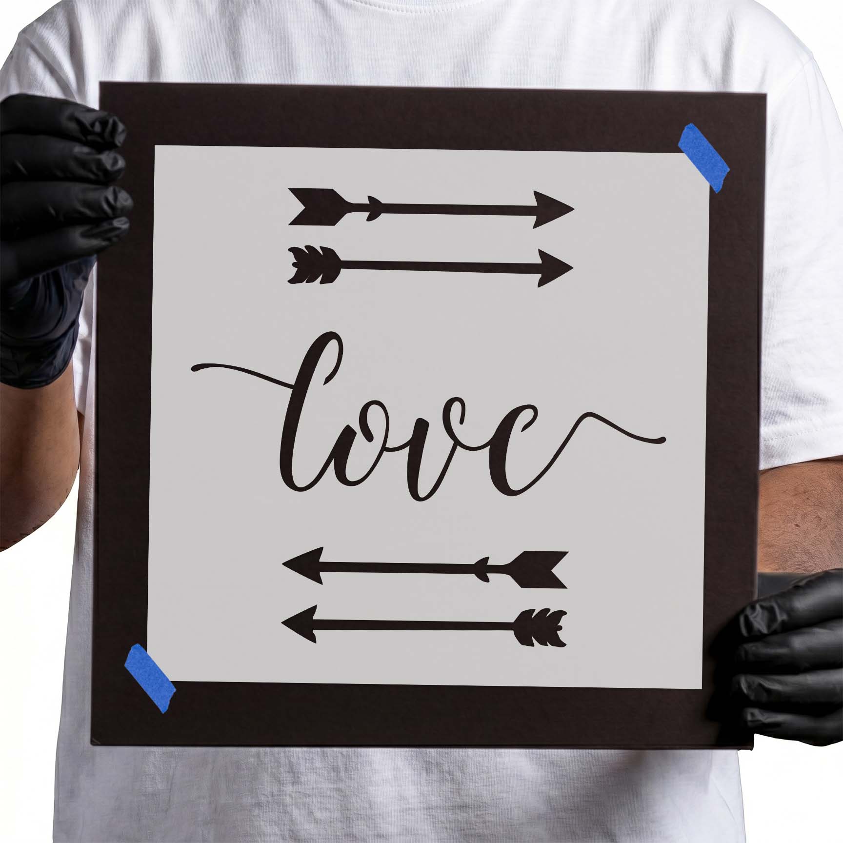 Love script stencil surrounded by decorative left and right arrows