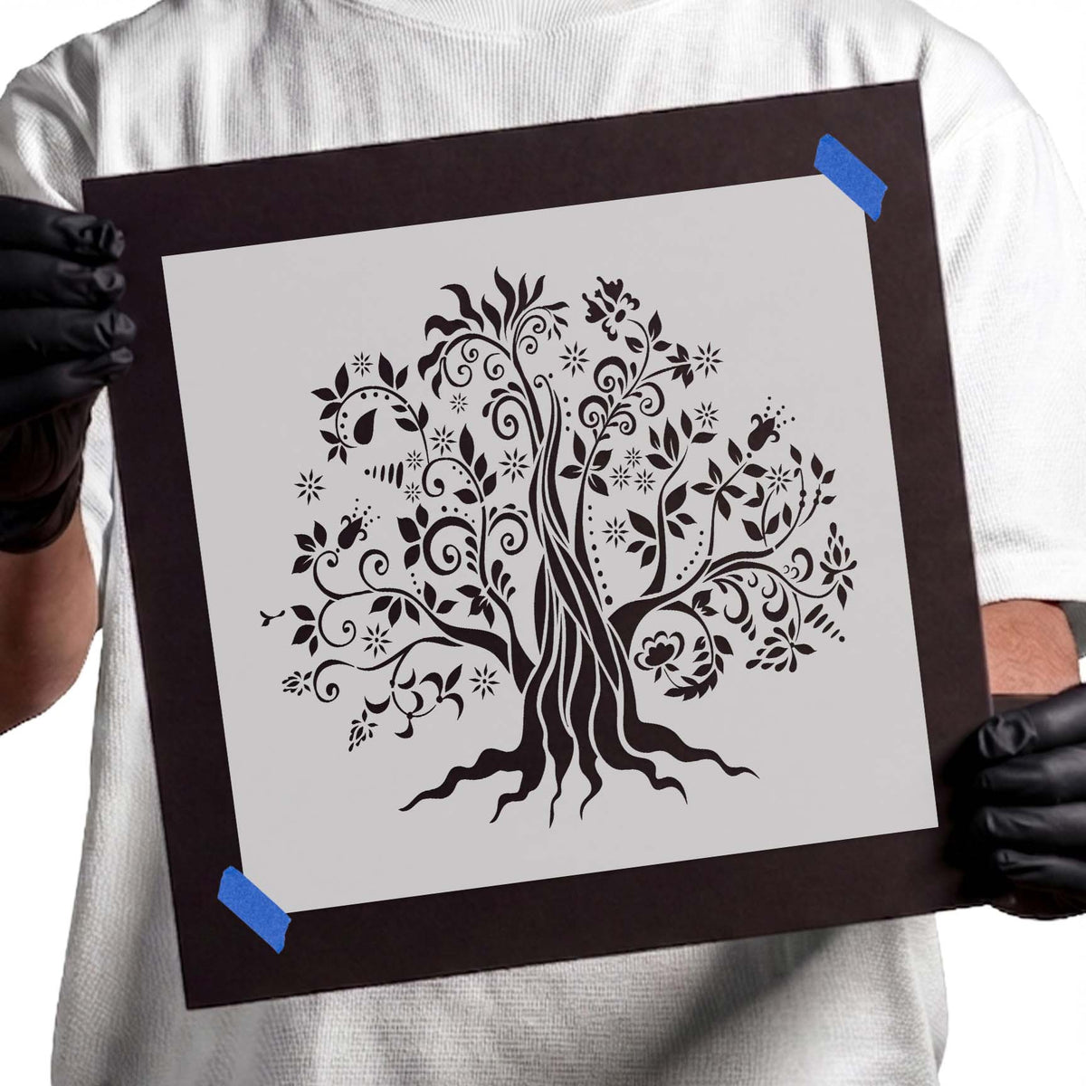 Magical tree stencil with swirling branches, flowers, leaves, and roots