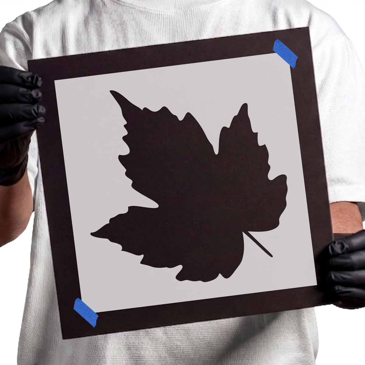 Maple leaf stencil with broad pointed lobes and slender stem