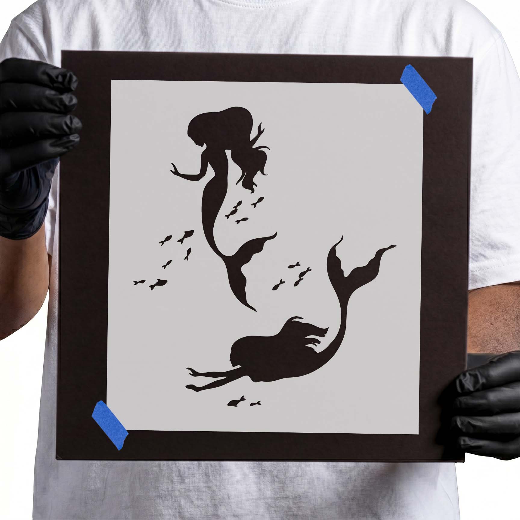 Two mermaid silhouettes swimming among small fish stencil