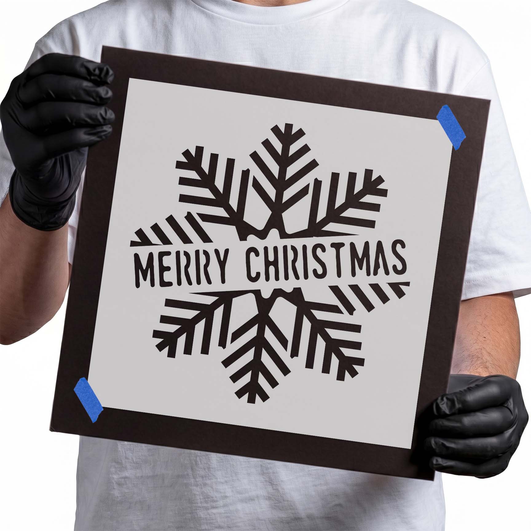Merry Christmas lettering stencil surrounded by geometric snowflake design