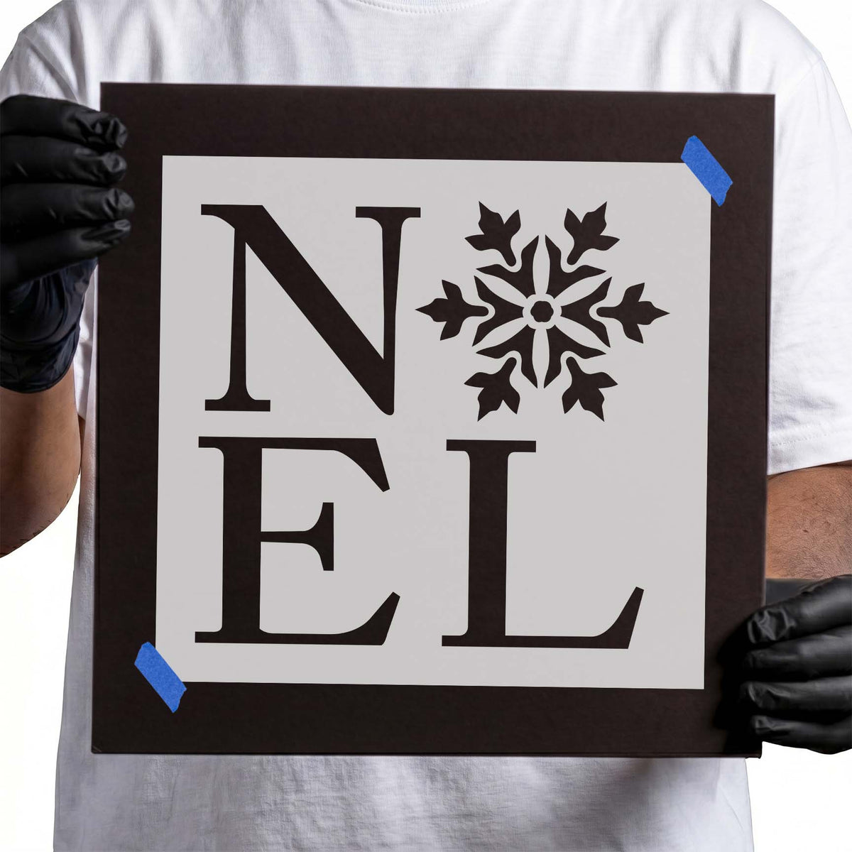 NOEL lettering stencil with decorative snowflake replacing the O