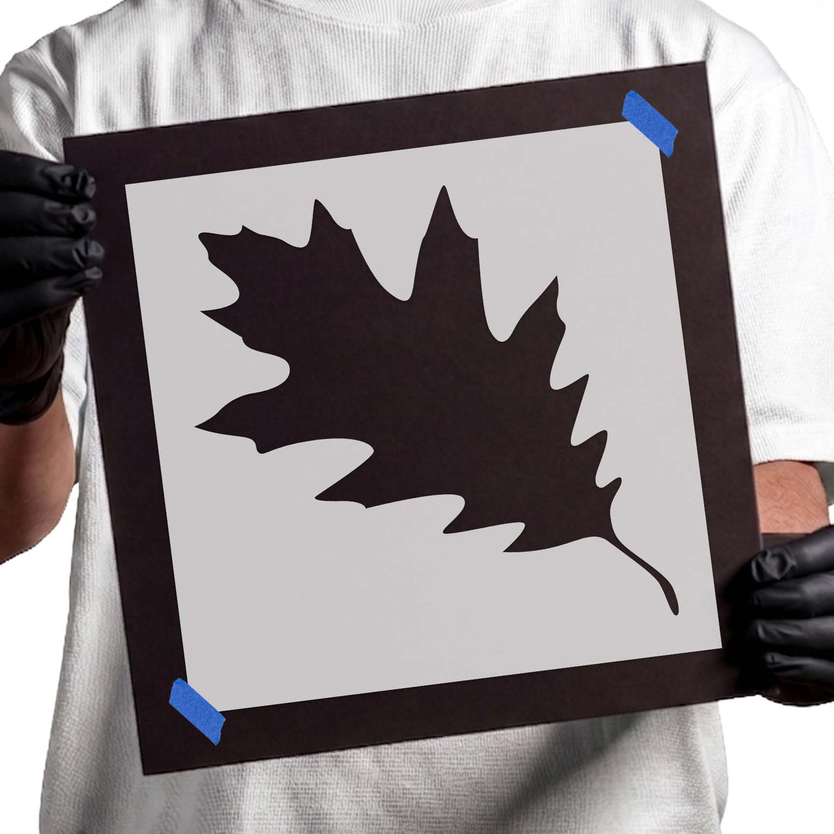 Oak leaf stencil with bold lobed edges and curved stem