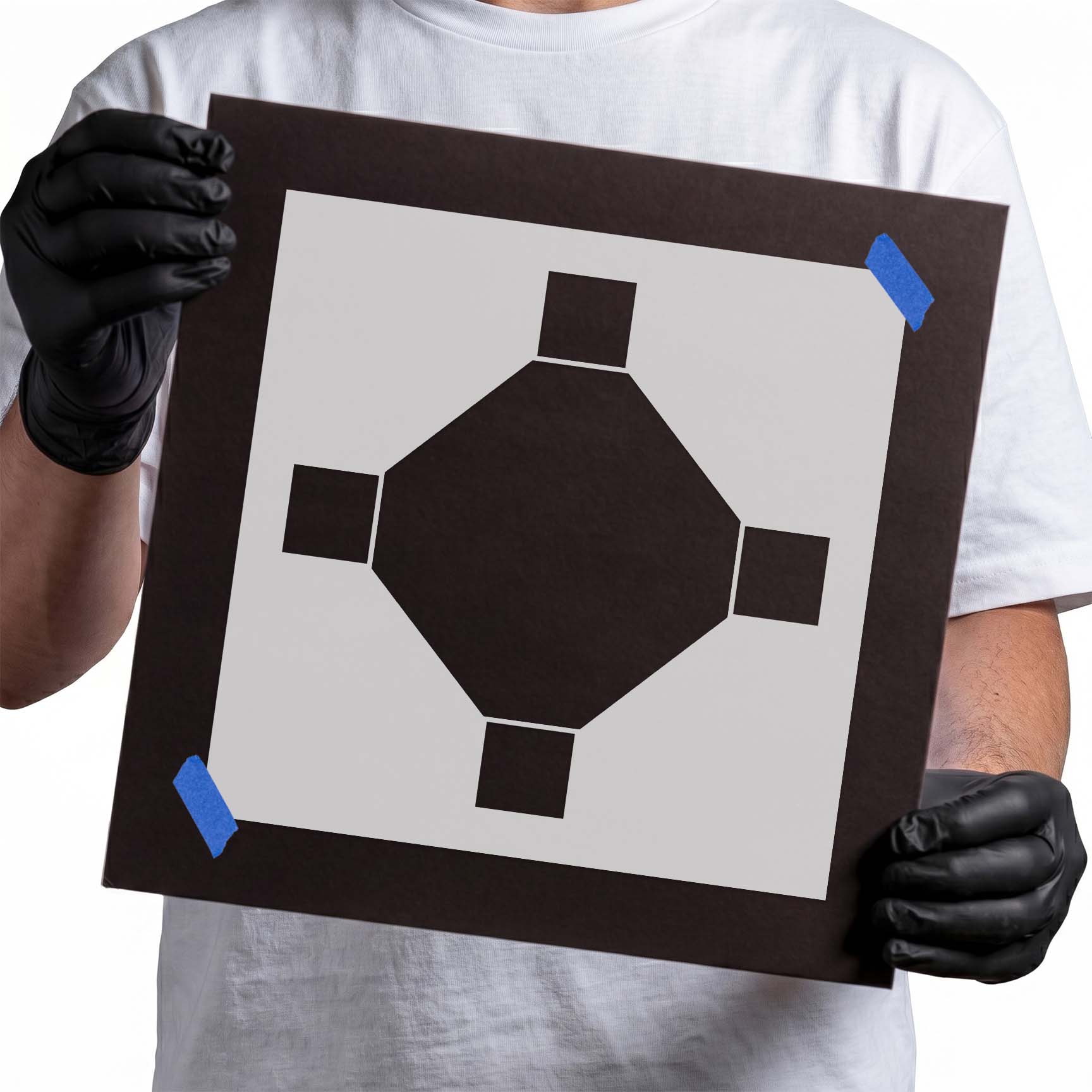 Person holding mylar Octogon Tile Stencil
