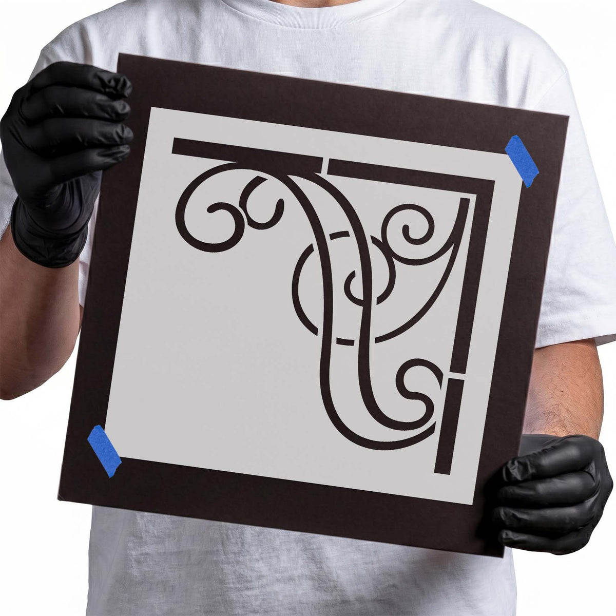 Ornate corner stencil with curved scrollwork and geometric border