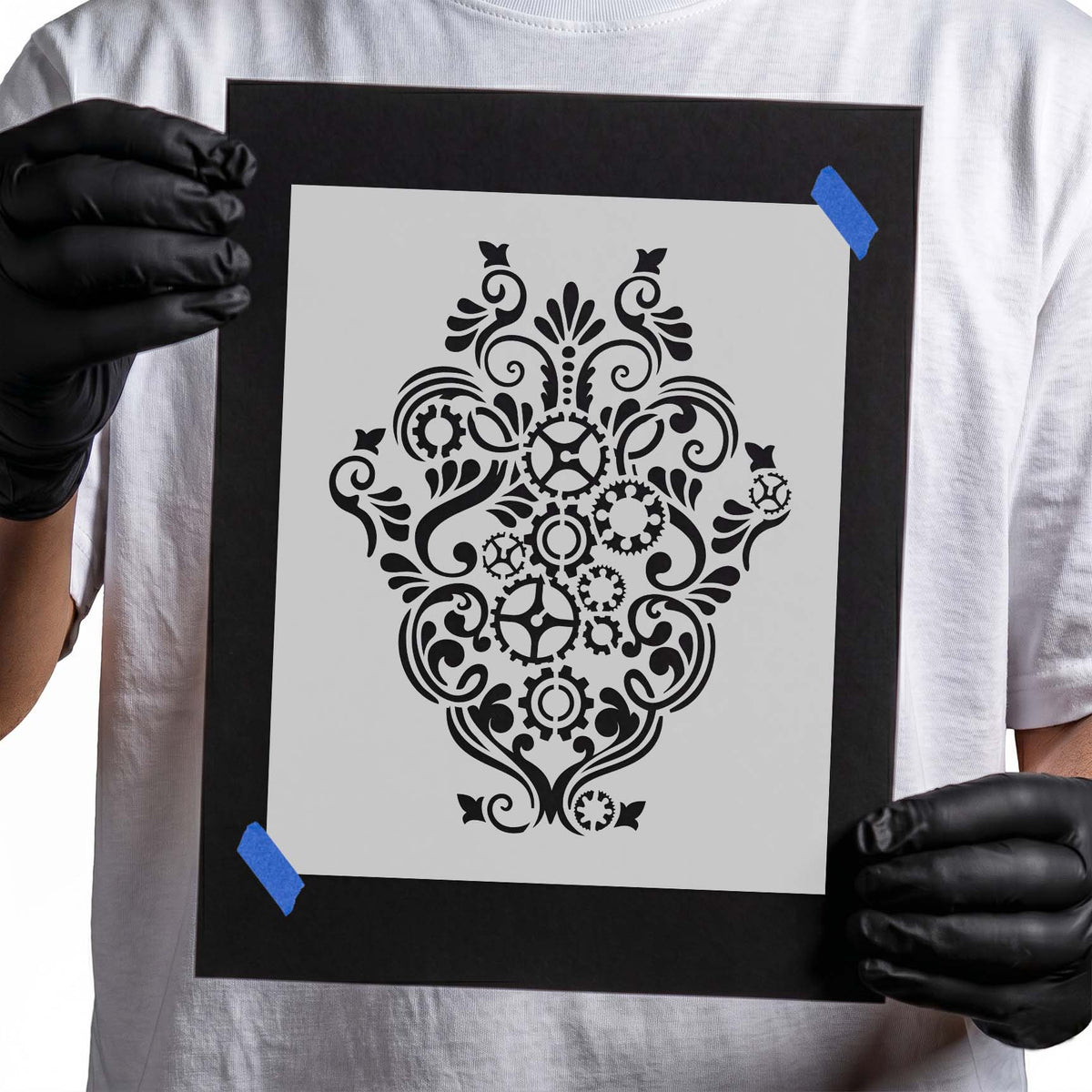 Ornate gear stencil with layered cogs and decorative scrollwork