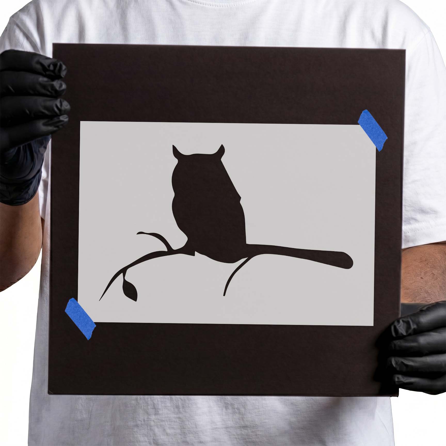 Person holding a reusbale Owl on a Branch Stencil