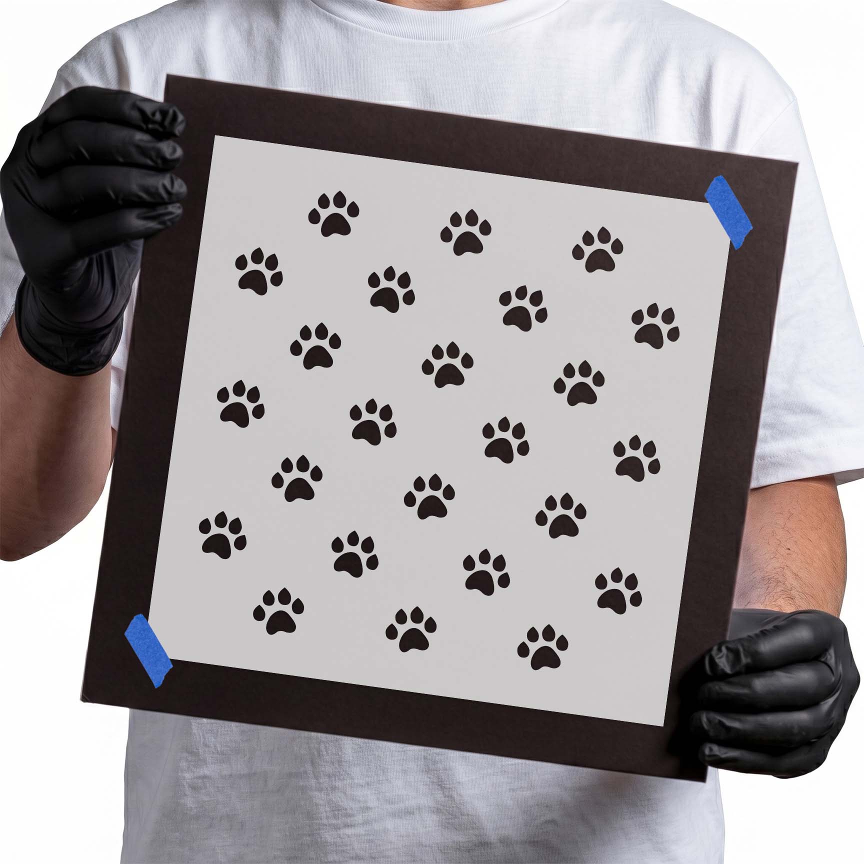 Stencil with scattered paw prints arranged in a repeating pattern