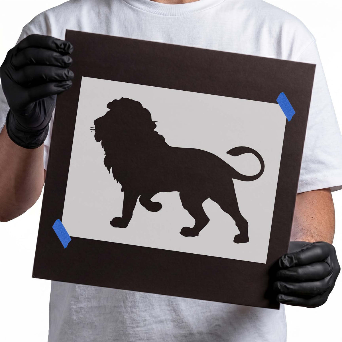 Walking lion stencil silhouette with full mane and curled tail