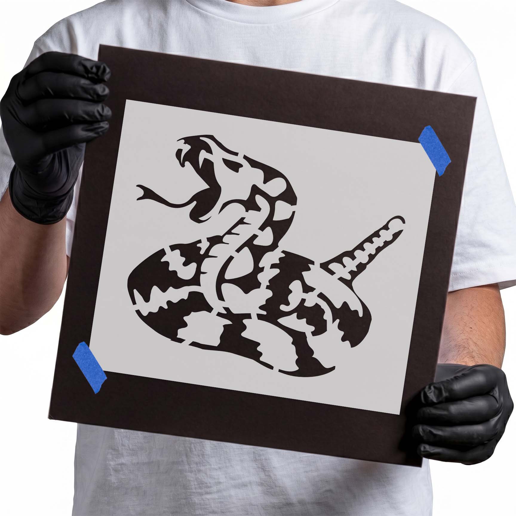 Coiled rattlesnake stencil with open mouth and raised rattle