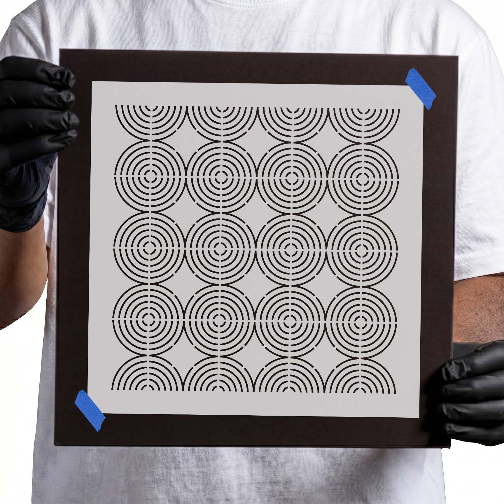 Stencil with repeating concentric circles arranged in a geometric grid