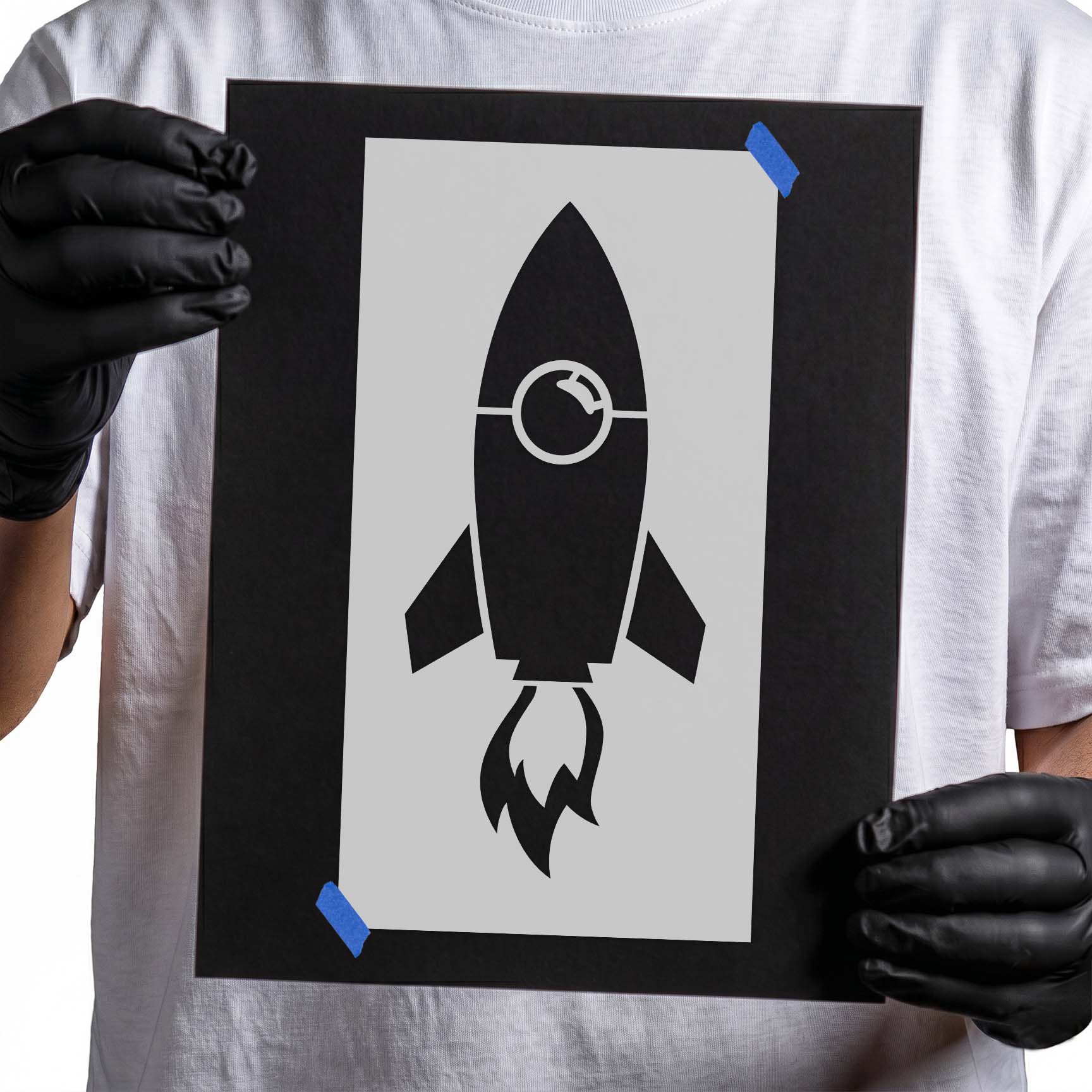 Rocket stencil with circular window, side fins, and flame