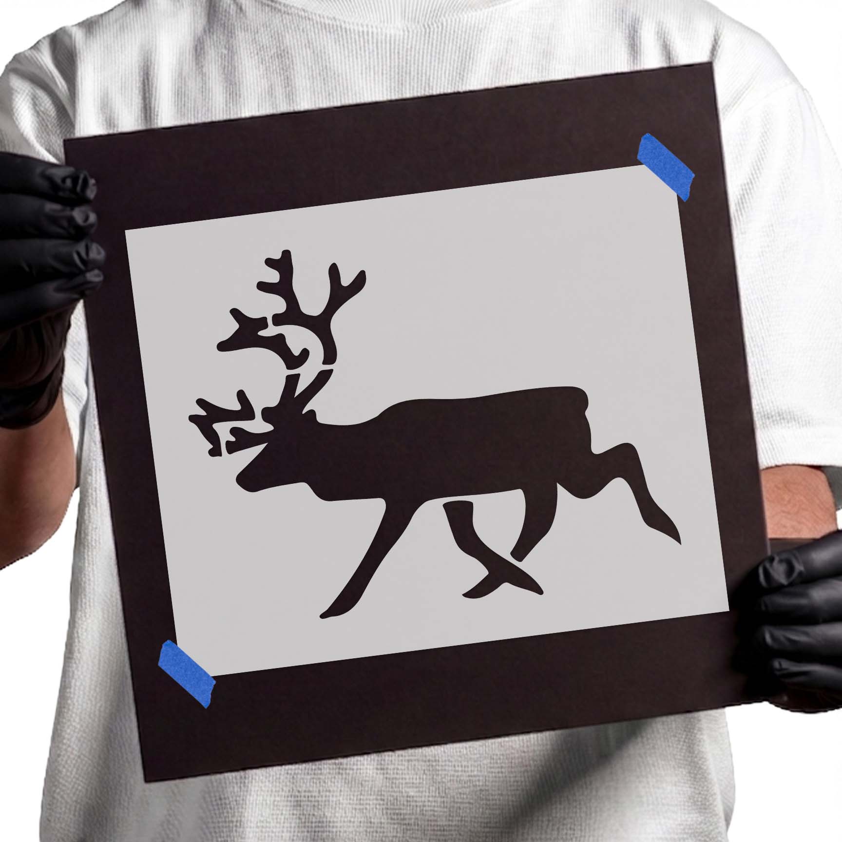 Running reindeer stencil with large branching antlers and extended legs