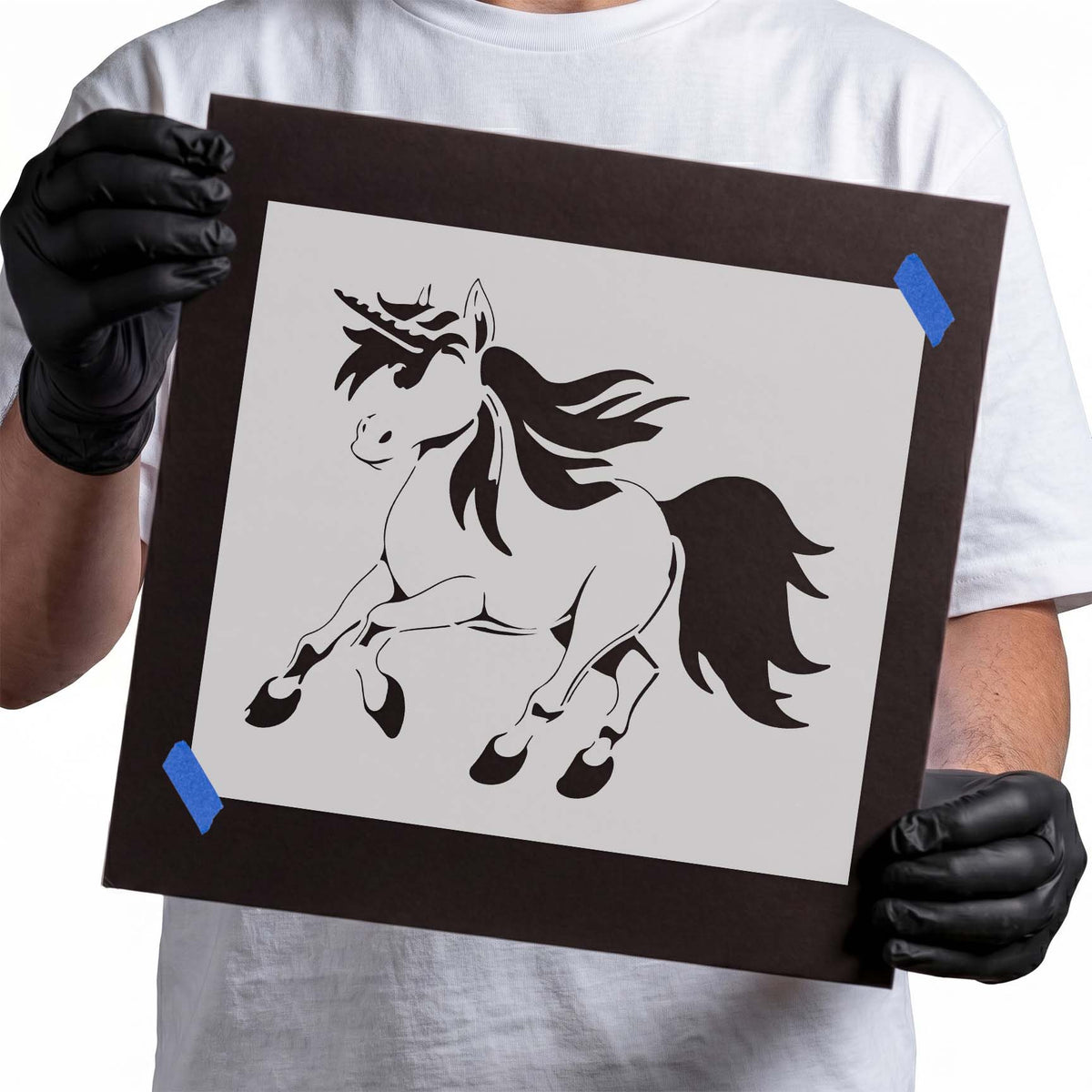 Running unicorn stencil with raised legs and flowing mane and tail