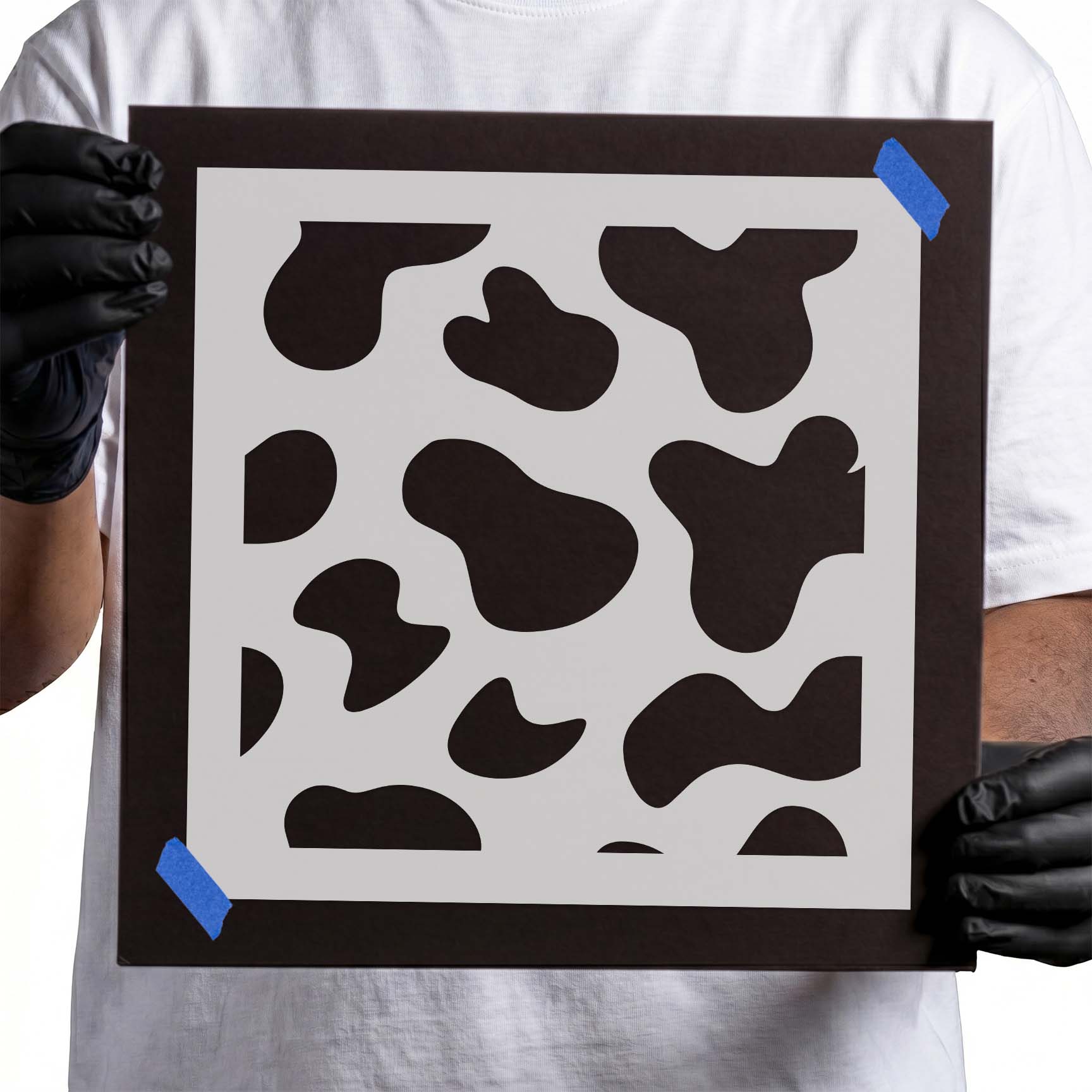 Cow print stencil with irregular all-over animal spots