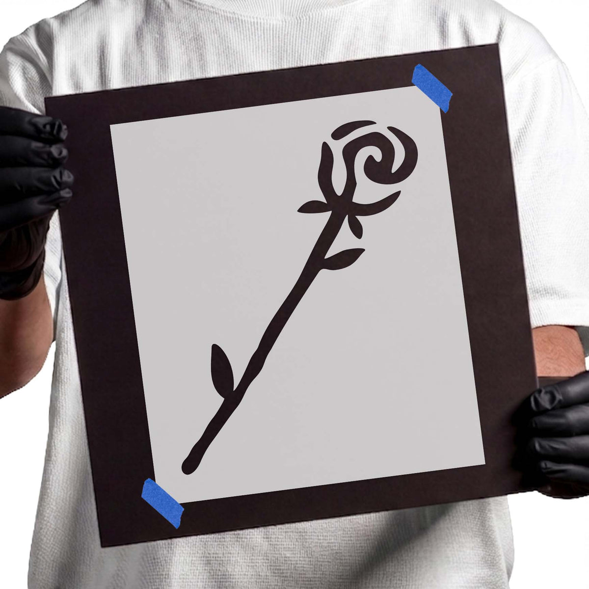 Single rose stencil with stylized bloom, long stem, and leaves
