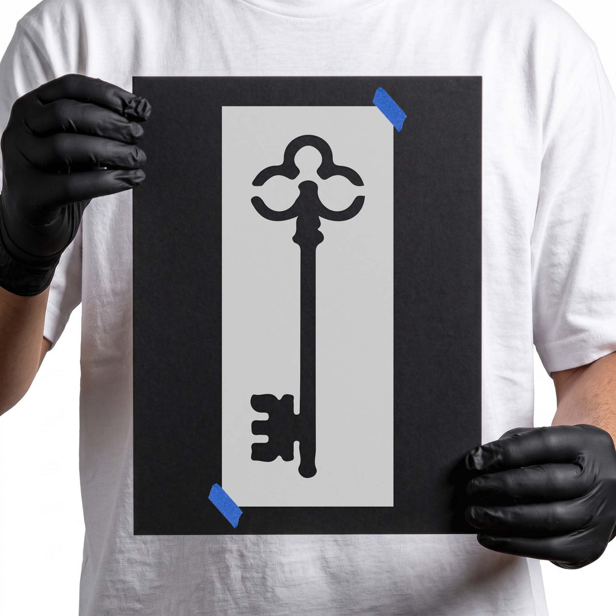 Skeleton key stencil with ornate curved bow and notched bit