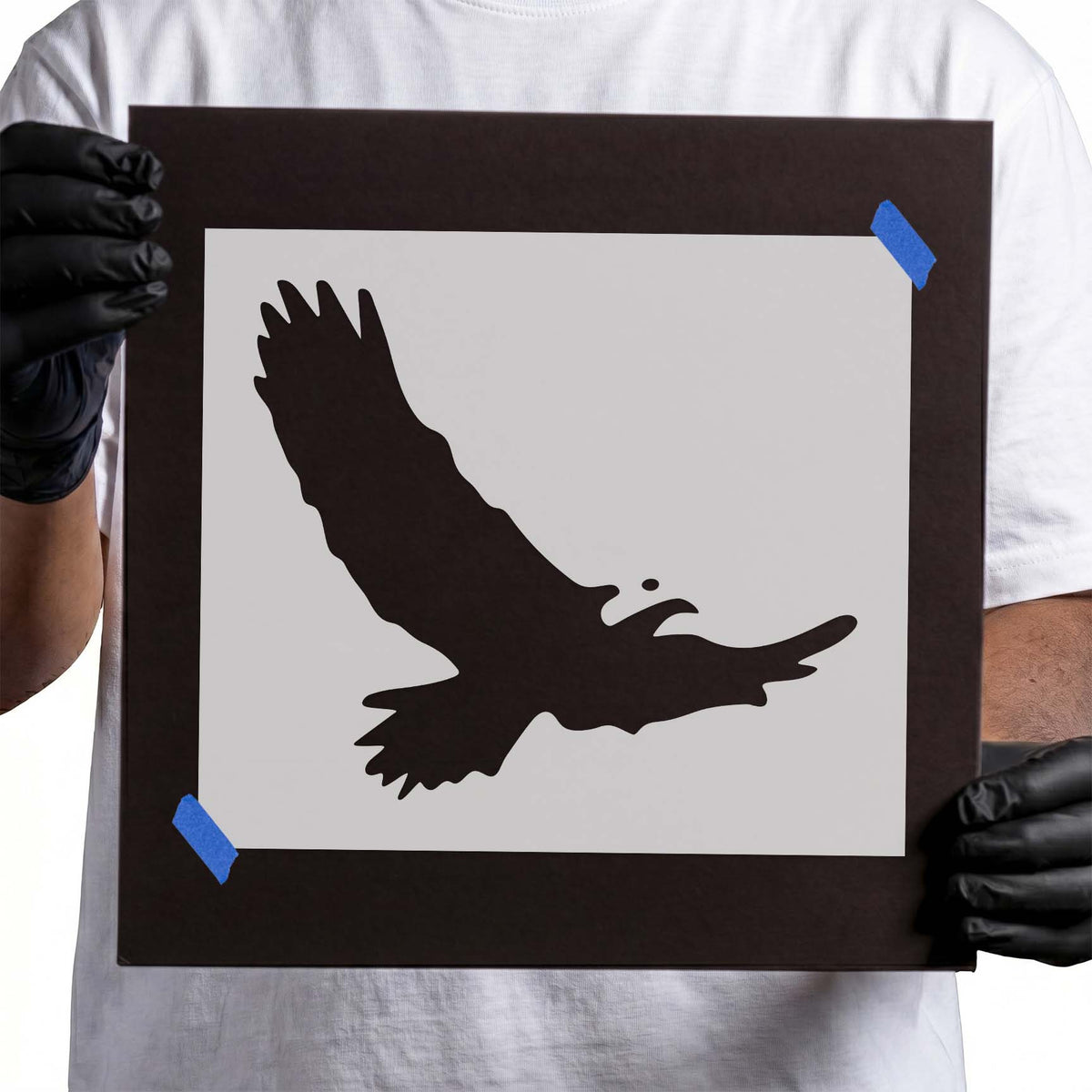 Soaring eagle stencil silhouette with wide outstretched wings