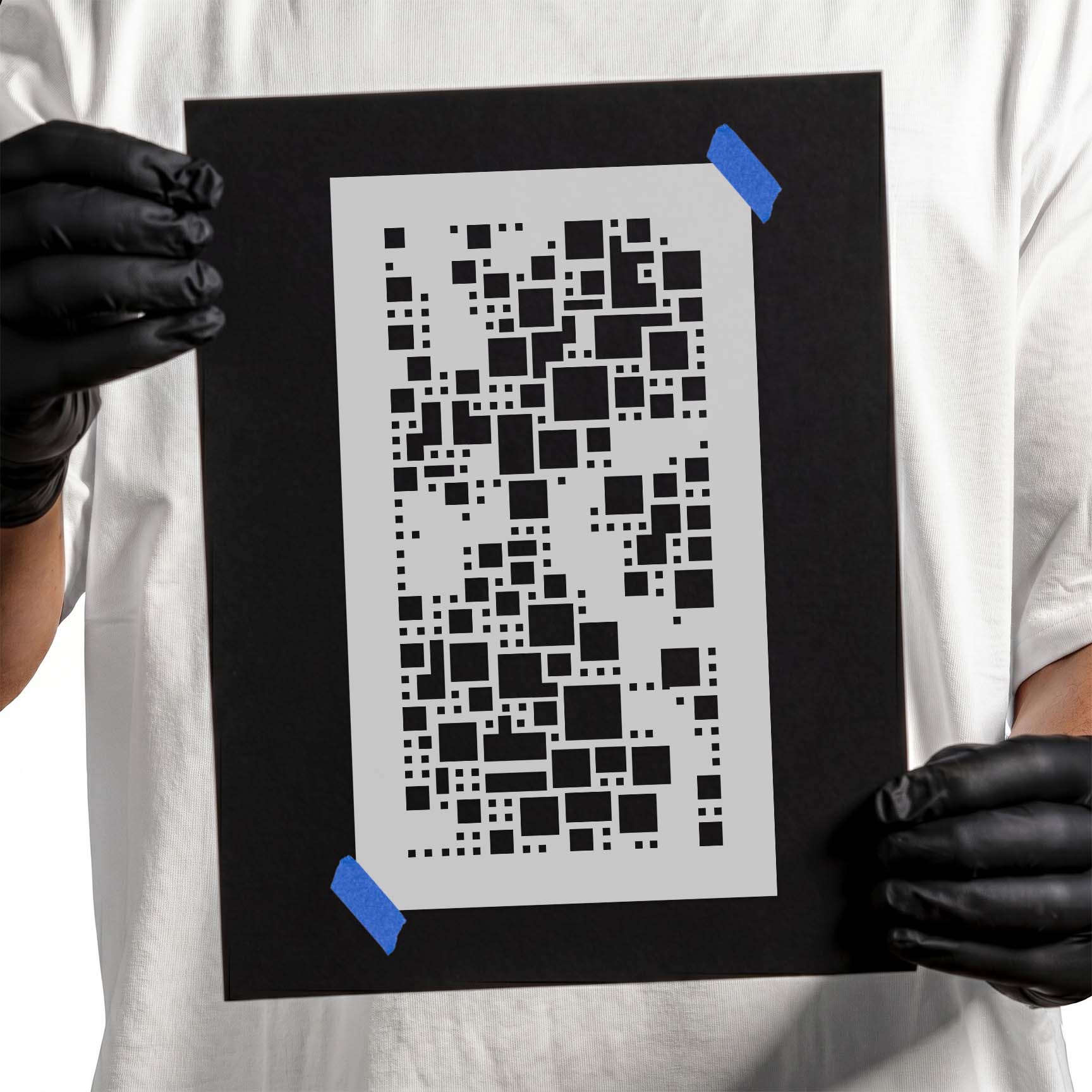 Person holding a reusable Squares Pattern Stencil