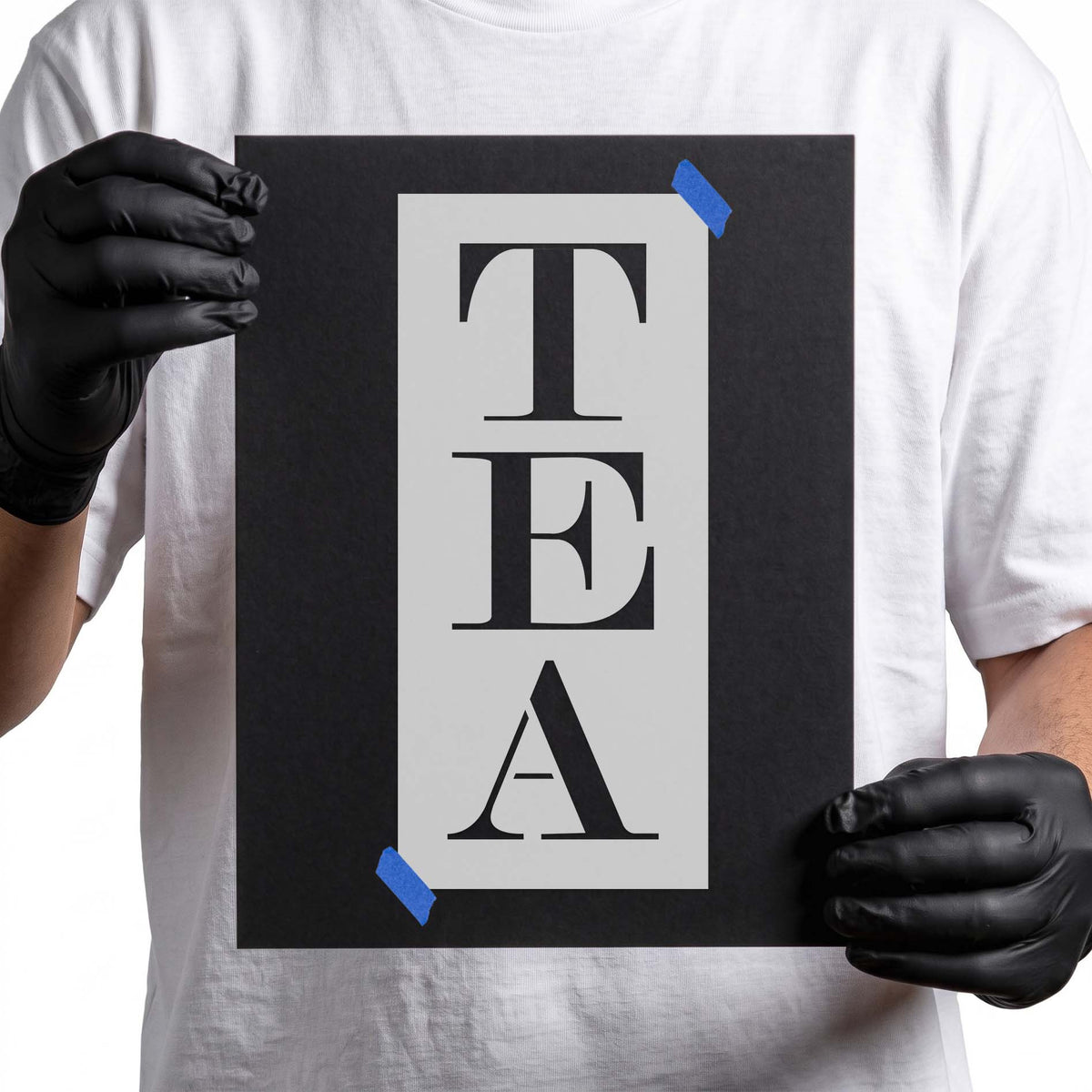Tea stencil with bold serif letters stacked vertically