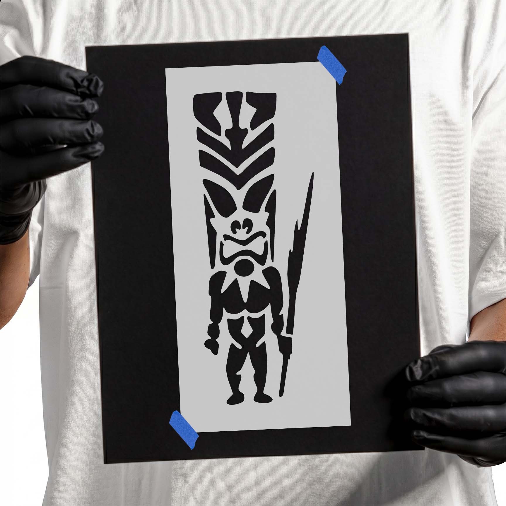 Tiki man stencil with ornate headdress and long spear