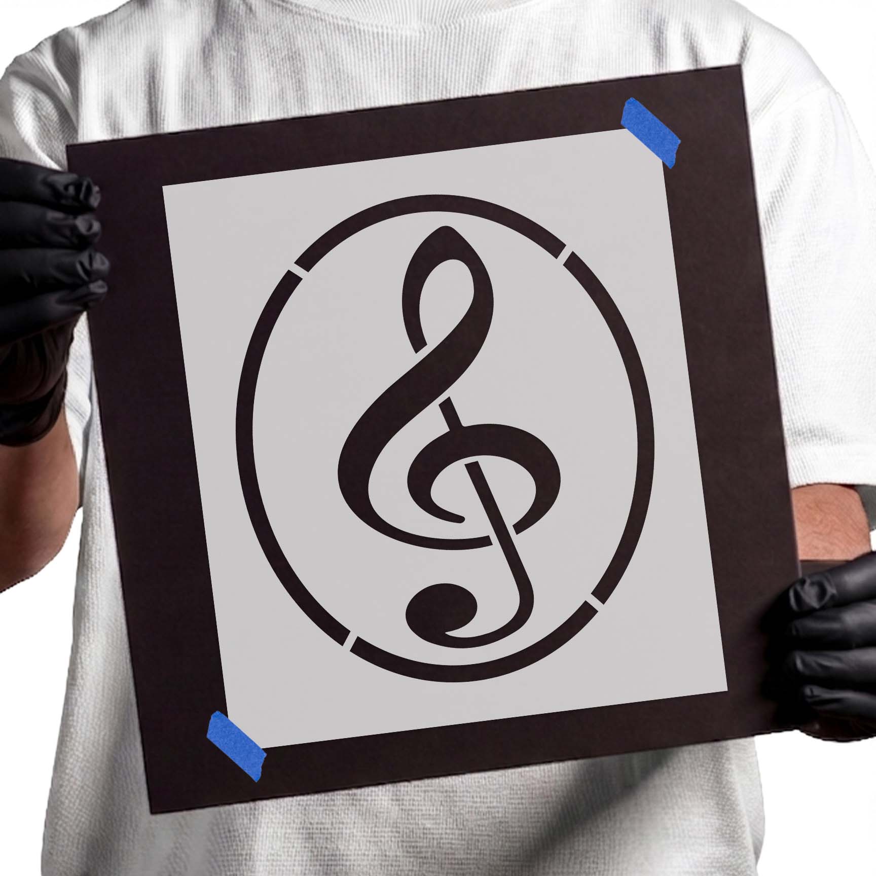 Treble clef stencil enclosed by a simple circular border