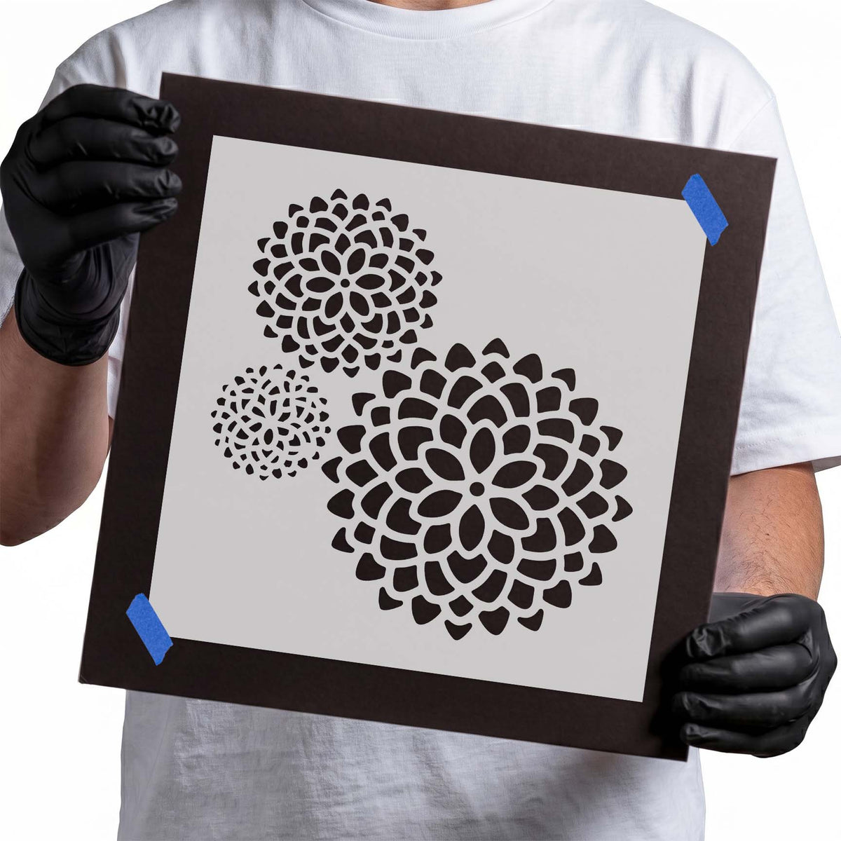 Three flower stencil motifs with layered petals in varied sizes