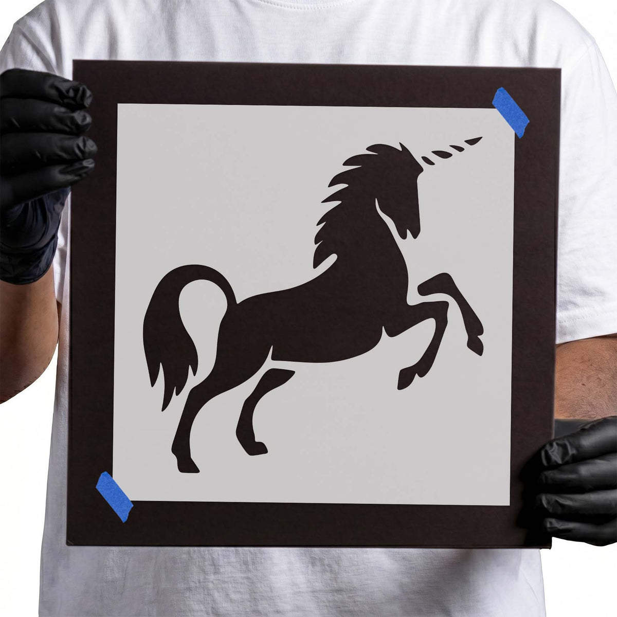 Unicorn stencil with spiral horn, flowing mane and raised front legs