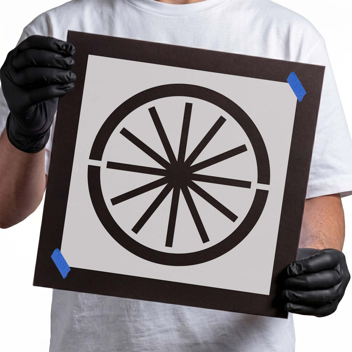 Wagon wheel stencil with bold circular rim and radial spokes